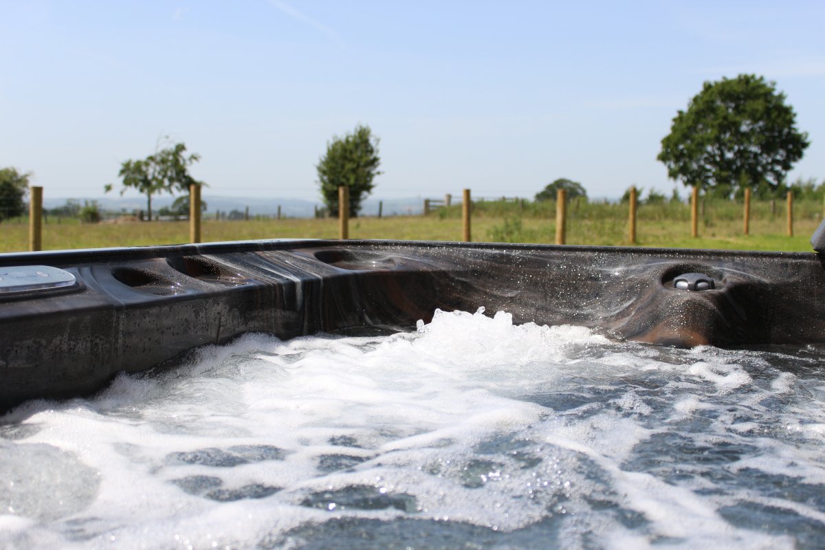 Marrington Farmhouse - gorgeous hot tub bubbles with views
